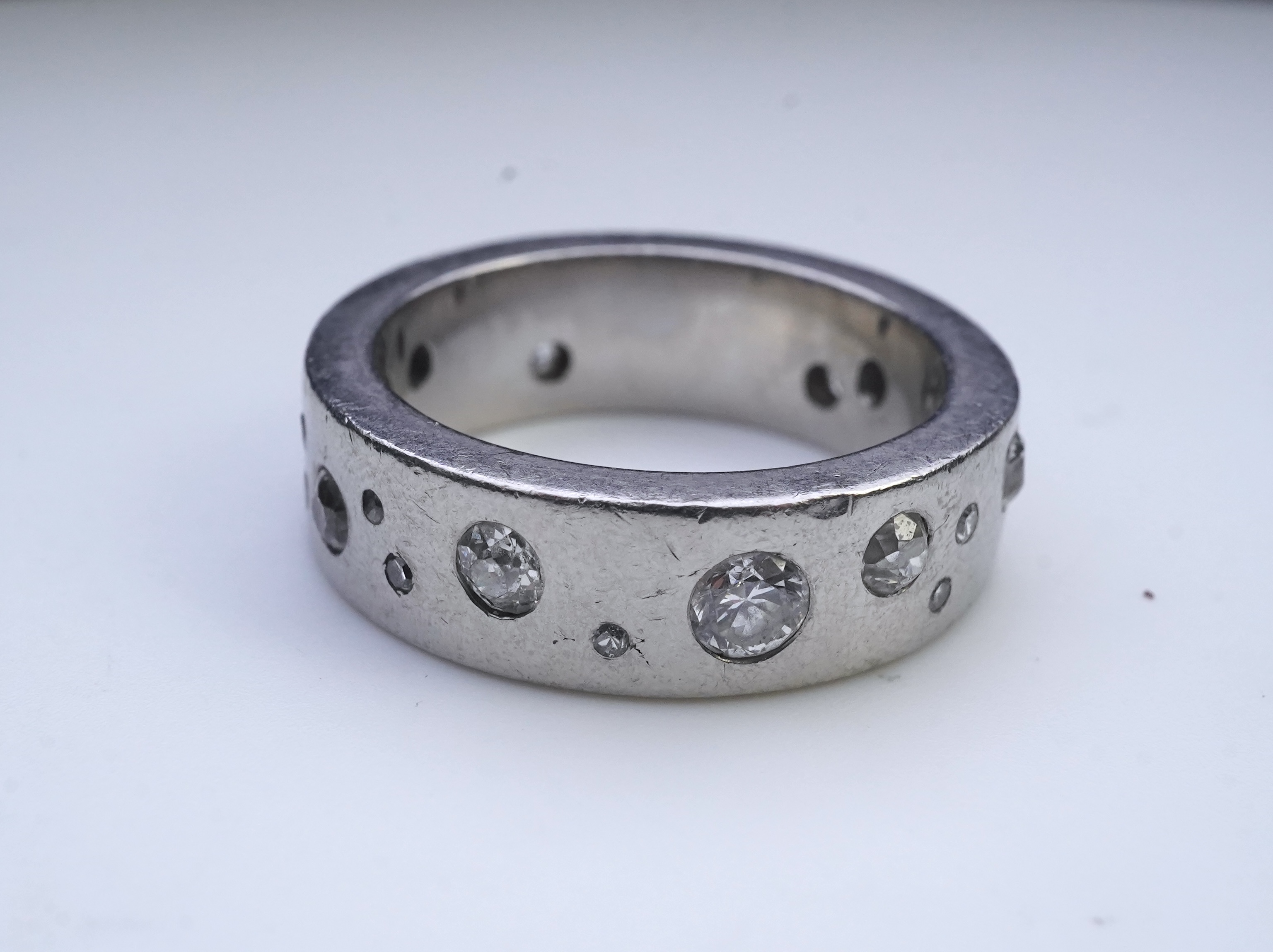 A platinum and diamond eternity ring